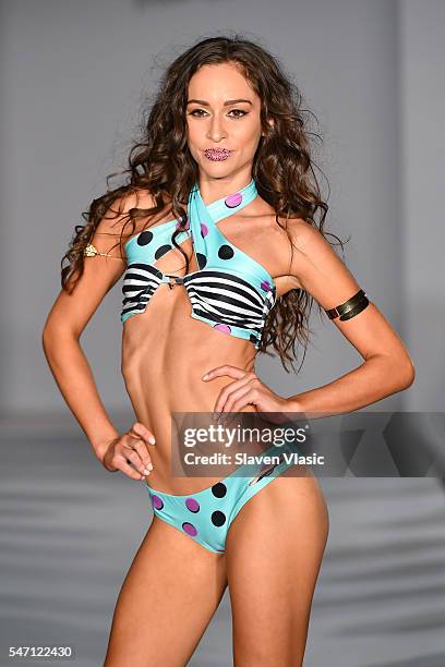 A model walks the runway at Versakini x Amanda Perna Runway Show Presented By Ivy at W South Beach on July 13, 2016 in Miami Beach, Florida.