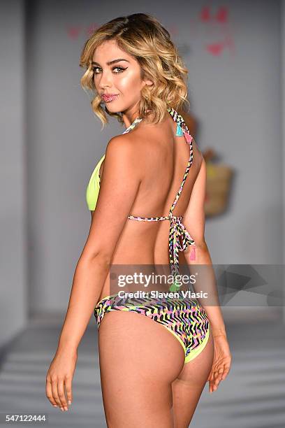 A model walks the runway at Versakini x Amanda Perna Runway Show Presented By Ivy at W South Beach on July 13, 2016 in Miami Beach, Florida.