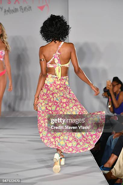 A model walks the runway at Versakini x Amanda Perna Runway Show Presented By Ivy at W South Beach on July 13, 2016 in Miami Beach, Florida.