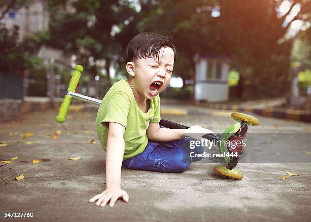 sudden braking tumbled him down - shorts down stock pictures, royalty-free photos & images