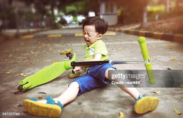 sudden braking tumbled him down - shorts down stock pictures, royalty-free photos & images