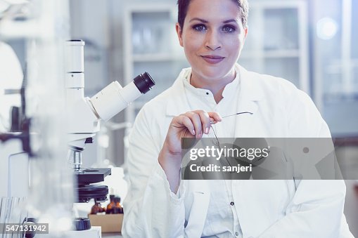 Science Photo Doctor Doctor Of Science Using A Microscope High-Res Stock Photo - Getty Images