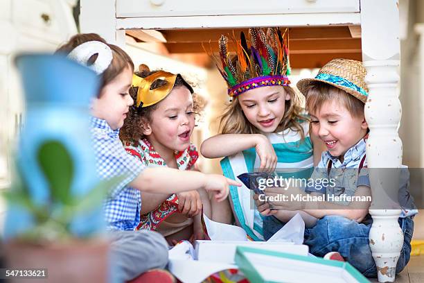 children opening presents at party - kids birthday present stock pictures, royalty-free photos & images