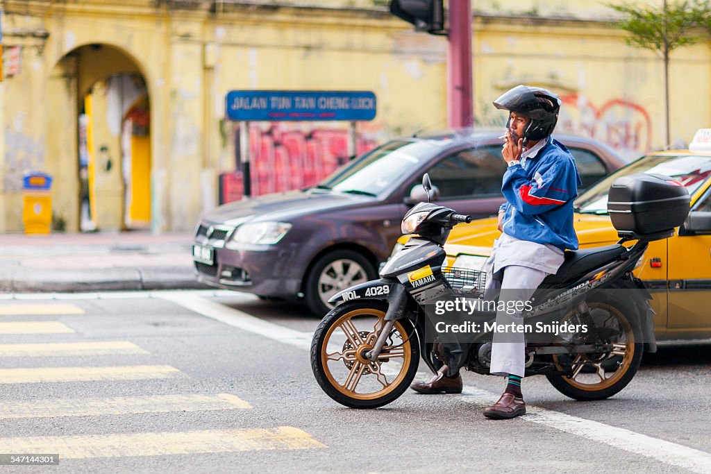 Smoking and driving a motorcycle