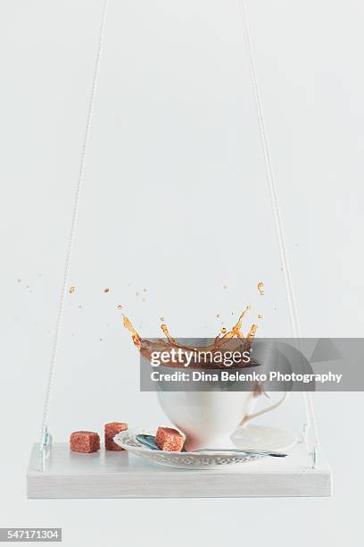 simple joy of swings and coffee - coffee slow motion stock pictures, royalty-free photos & images