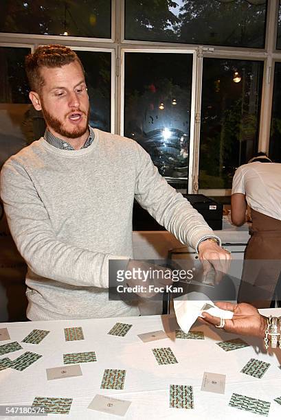 Pastry Chef Yann Couvreur proposes cisors cut toffees during the "La Cafete Nationale" by Le Fooding Auction Event to Benefit Children of Congo...