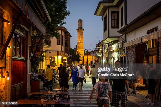Tourists walk through the Old Town tourist district on July 13, 2016 in Antalya, Turkey. Russian President Vladimir Putin last month officially...