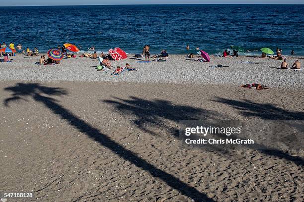 People enjoy the beach on July 11, 2016 in Antalya, Turkey. Russian President Vladimir Putin last month officially lifted travel restrictions on...
