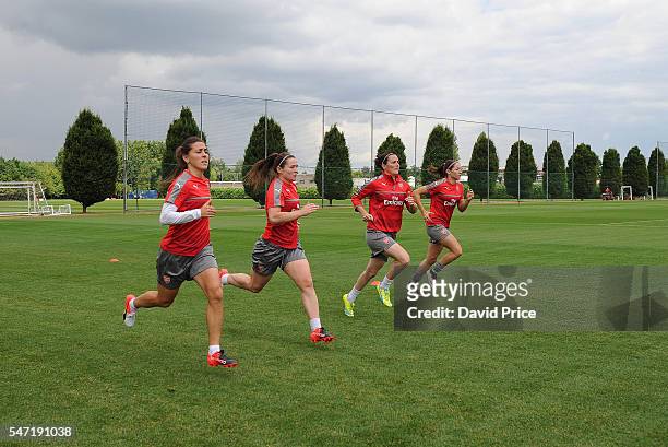 Fara Williams, Emma Mitchell, Natalia Pablos Sanchon and Vicky Losada of Arsenal Ladies during their training session on July 13, 2016 in London...