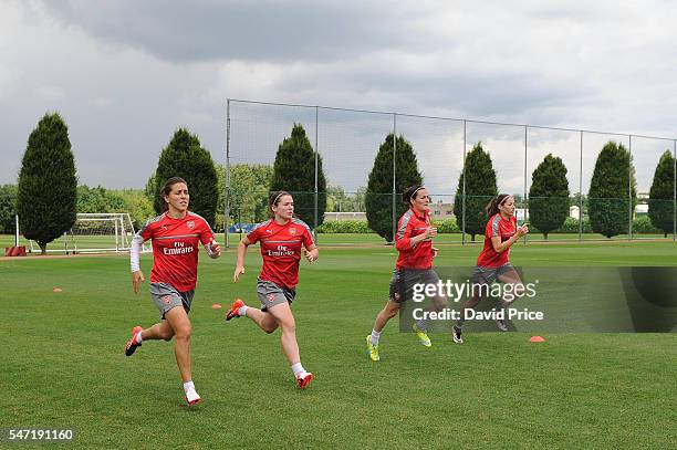 Fara Williams, Emma Mitchell, Natalia Pablos Sanchon and Vicky Losada of Arsenal Ladies during their training session on July 13, 2016 in London...