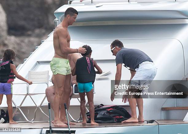 Real Madrid football player Cristiano Ronaldo and his son Cristiano Ronaldo jr are seen on July 13, 2016 in Ibiza, Spain.