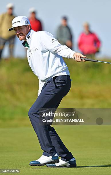 Golfer Jimmy Walker reacts to his putt on the 4th Green during his first round on the opening day of the 2016 British Open Golf Championship at Royal...