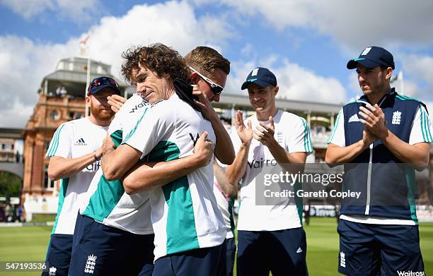 Jake Ball of England is presented with his test cap by Bruce French ahead of the 1st Investec Test between England and Pakistan at Lord's Cricket...