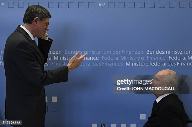 German Finance Minister Wolfgang Schaeuble and visiting US Finance Secretary Jacob Lew talk prior a joint press conference at the finance ministry in...