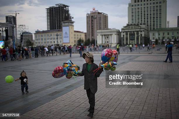 Vendor displays balloons for sale at Sukhbataar Square, known as Chinggis Square, in Ulaanbaatar, Mongolia, on Wednesday, July 13, 2016. The nation's...