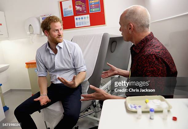 Prince Harry has blood taken by Specialist Psychotherapist Robert Palmer as he takes an HIV test during a visit to Burrell Street Sexual Health...