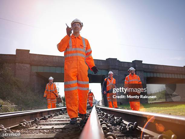 railway workers on railway track - railroad track stock-fotos und bilder