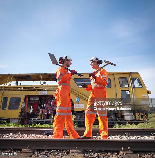 railway maintenance workers in discussion on track - rail worker stock pictures, royalty-free photos & images