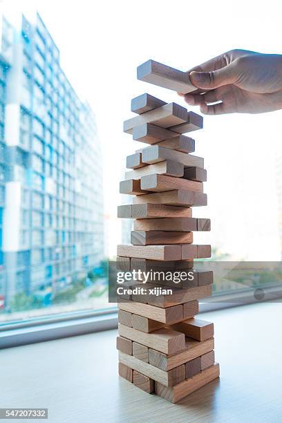 Jenga Risk 90 Risk Jenga Stock Photos, High-Res Pictures, and Images - Getty Images