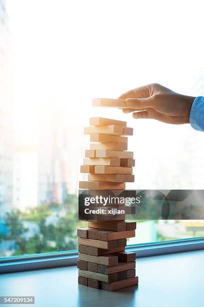 Jenga Risk 90 Risk Jenga Stock Photos, High-Res Pictures, and Images - Getty Images