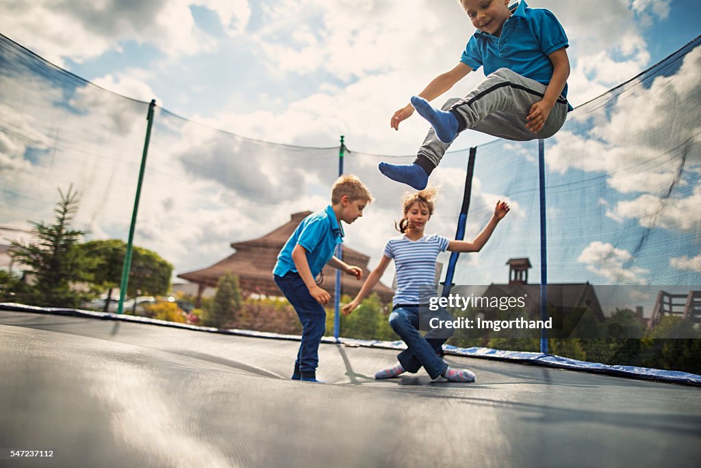 Kids jumping on trampoline