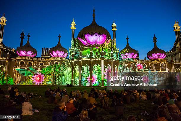 Locals enjoying Brighton Royal Pavilion lit up for the Brighton festival 2016 by Dr Blighty projections on the 25th of May 2016 in Brighton, United...