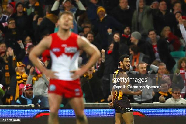 Cyril Rioli of the Hawks celebrates kicking a goal during the round 17 AFL match between the Sydney Swans and the Hawthorn Hawks at Sydney Cricket...