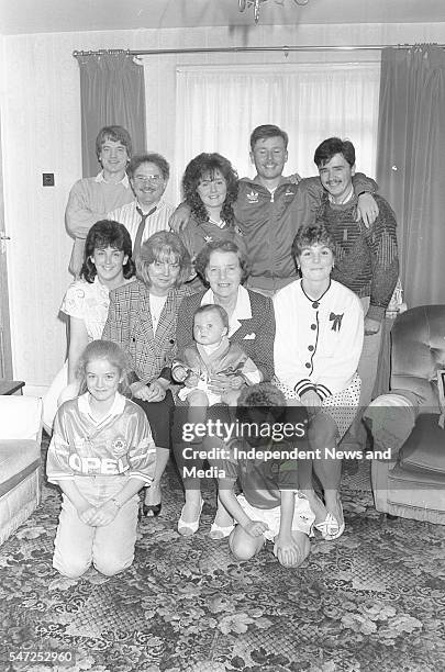 Kathleen O'Leary, wife of Irish soccer team kitman Charlie O'Leary, is pictured surrounded by her family at their Artane home 26/6/90 . .