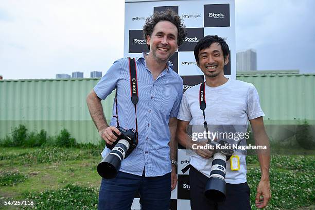 Getty Images photographer Adam Pretty and former Olympian Dai Tamesue pose for a photograph during his track and field class for children 'Tamesue...