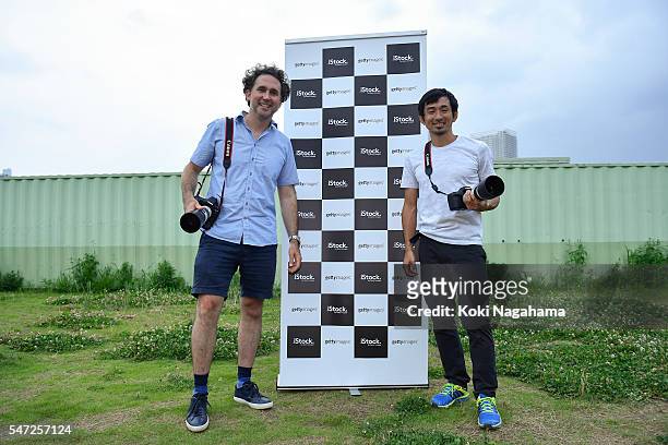 Getty Images photographer Adam Pretty and former Olympian Dai Tamesue pose for a photograph during his track and field class for children 'Tamesue...