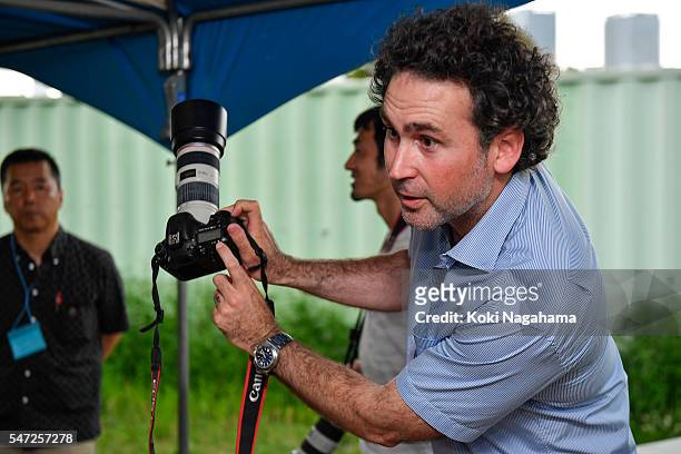 Getty Images photographer Adam Pretty teaches participants how to take photographs former Olympian Dai Tamesue during his track and field class for...