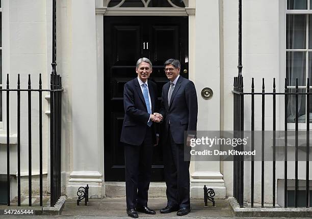 Chancellor of the Exchequer Philip Hammond greets U.S. Secretary of the Treasury Jacob Lew outside 11 Downing Street during his first day in the role...