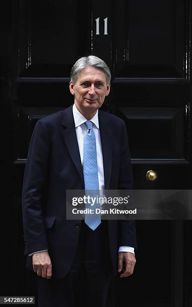 Chancellor of the Exchequer Philip Hammond poses outside 11 Downing Street after meeting with U.S. Secretary of the Treasury Jacob Lew during his...