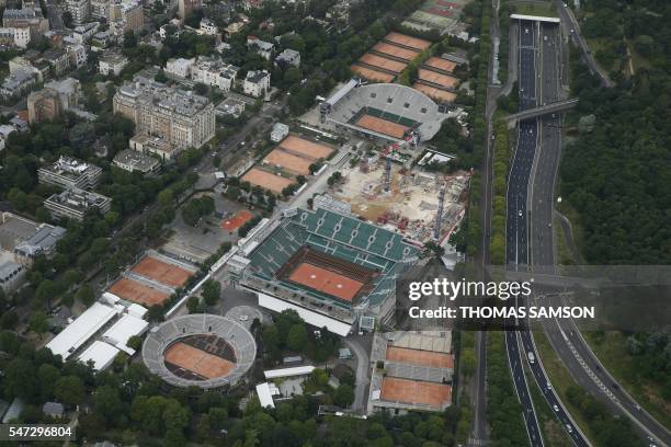 Picture taken on July 14, 2016 shows an aerial view of the Roland Garros stadium and the Jardin des Serres d'Auteuil in Paris. / AFP PHOTO / THOMAS...