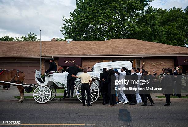 Pallbearers load the casket carrying Philando Castile at the Brooks Funeral Home on July 14, 2016 in St. Paul, Minnesota. Castile was shot and killed...