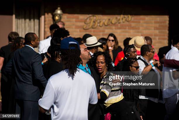 People embrace outside the funeral of Philando Castile at the Brooks Funeral Home on July 14, 2016 in St. Paul, Minnesota. Castile was shot and...