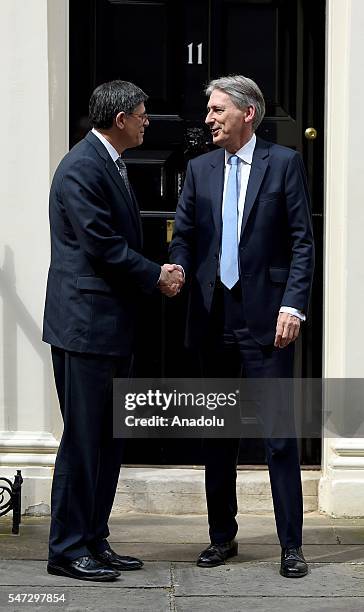 Chancellor of the Exchequer Philip Hammond greets U.S. Secretary of the Treasury Jacob Lew outside the 11 Downing Street during his first day in his...