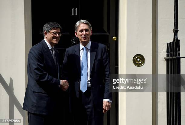 Chancellor of the Exchequer Philip Hammond greets U.S. Secretary of the Treasury Jacob Lew outside the 11 Downing Street during his first day in his...