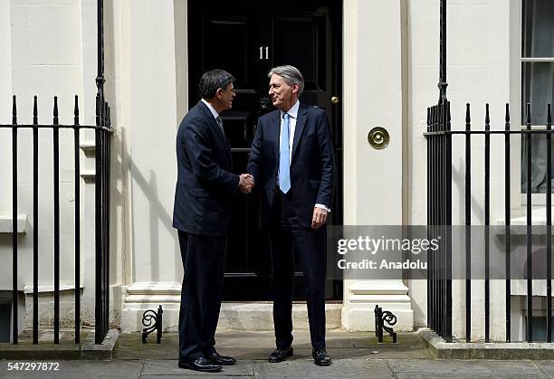 Chancellor of the Exchequer Philip Hammond greets U.S. Secretary of the Treasury Jacob Lew outside the 11 Downing Street during his first day in his...