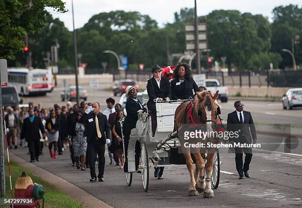 Horse drawn carriage leads a procession carrying the casket of of Philando Castile on July 14, 2016 in St. Paul, Minnesota. Castile was shot and...