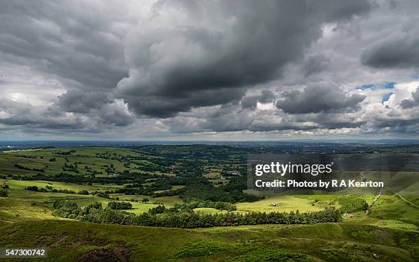 heavy clouds over english countryside in summer - grey clouds stock pictures, royalty-free photos & images