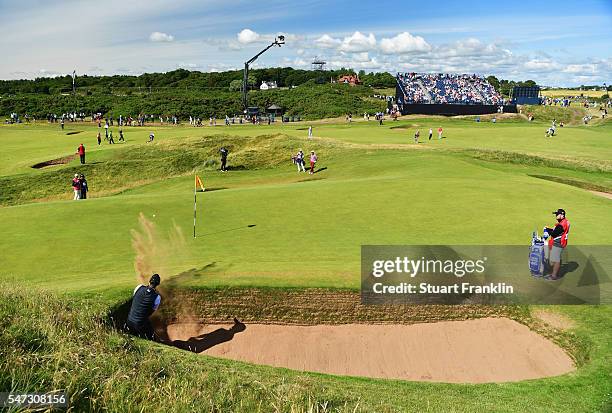 Chris Wood of England hits a bunker shot on the 8th during the first round on day one of the 145th Open Championship at Royal Troon on July 14, 2016...