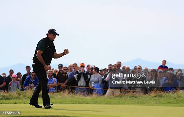 Phil Mickelson of the United States celebrates a birdie putt on the the 17th green during the first round on day one of the 145th Open Championship...