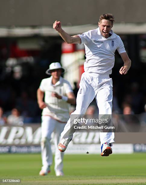 Chris Woakes of England celebrates taking the wicket of Asad Shafiq of Pakistan during day one of the 1st Investec Test match between England and...