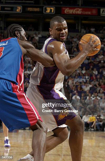 Forward Alton Ford of the Phoenix Suns posts up forward Ben Wallace of the Detroit Pistons during the NBA game at America West Arena in Phoenix,...