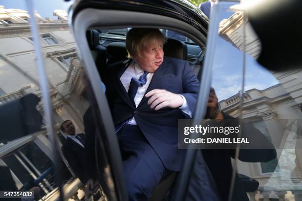 British Foreign Secretary Boris Johnson gets into a car as he leaves after attending an event at the French Ambassador's residence in west London on...