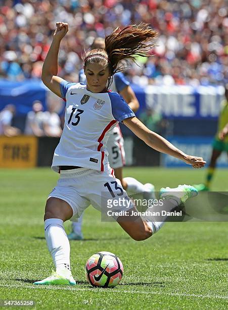Alex Morgan of the United States shoots against South Africa during a friendly match at Soldier Field on July 9, 2016 in Chicago, Illinois. The...