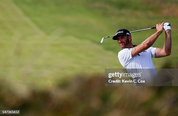 Dustin Johnson of the United States plays a shot during the first round on day one of the 145th Open Championship at Royal Troon on July 14, 2016 in...