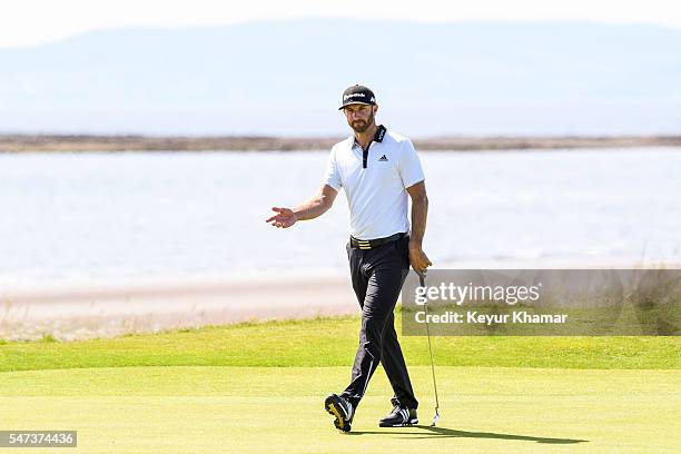 Dustin Johnson of the United States reacts to missing a birdie putt on the fifth hole green during the first round on day one of the 145th Open...