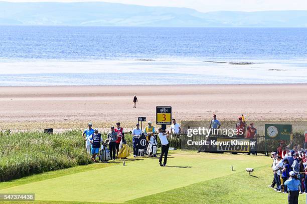 Dustin Johnson of the United States tees off on the third hole during the first round on day one of the 145th Open Championship at Royal Troon on...